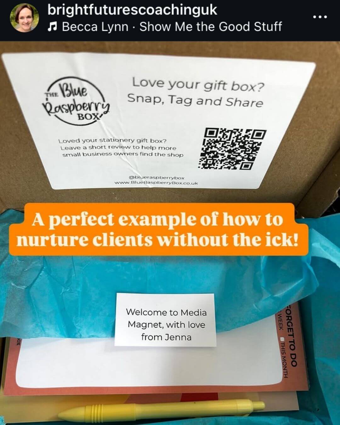 Gift box with Blue Raspberry Box branding and promotional text overlay
