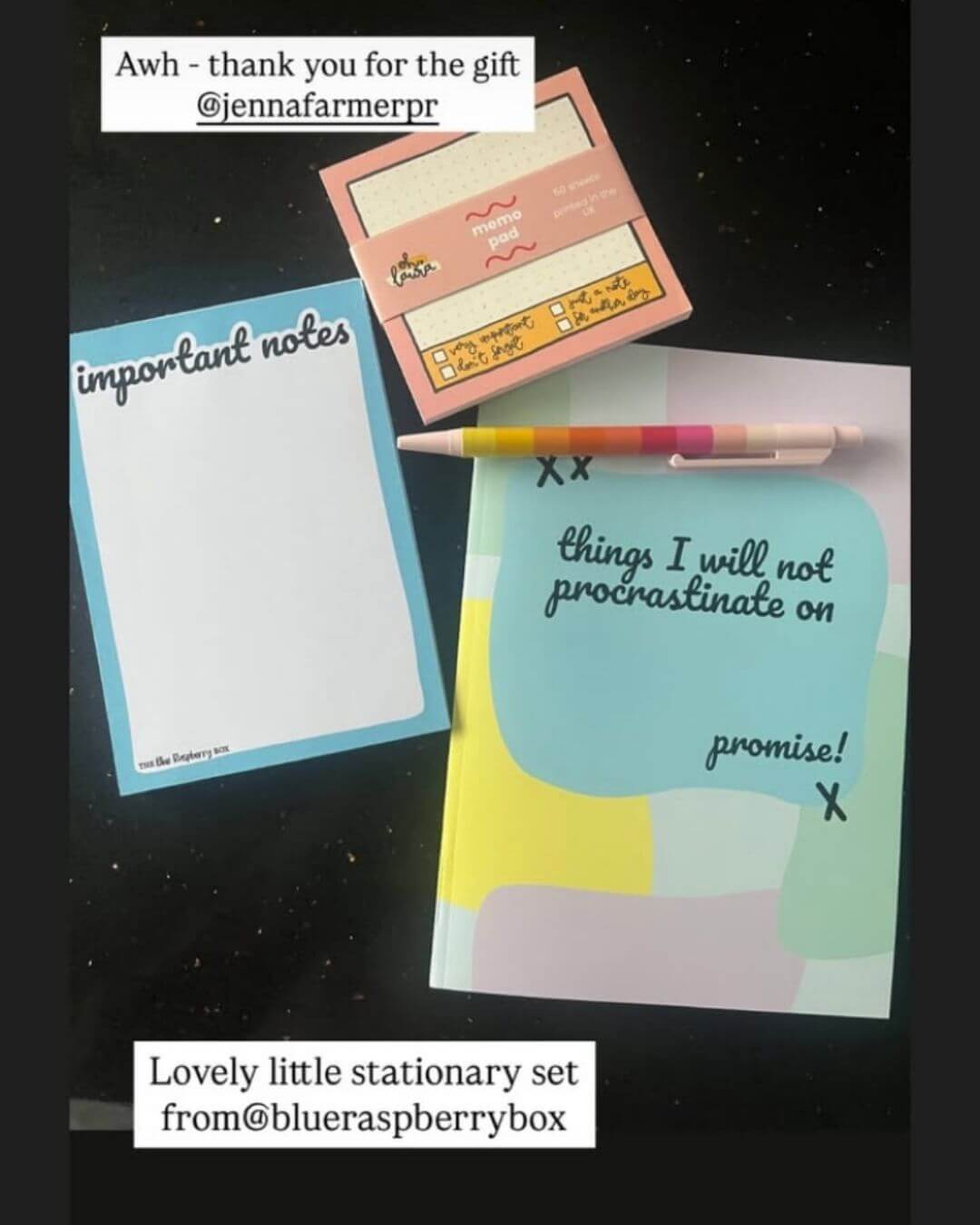 Stationery set with a notepad, memo notes, and pen on a dark background